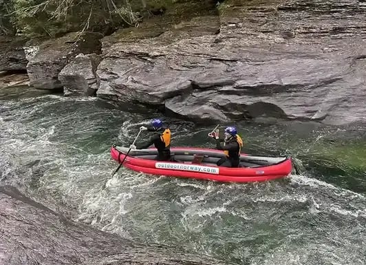 Canoeing through rocky rapids